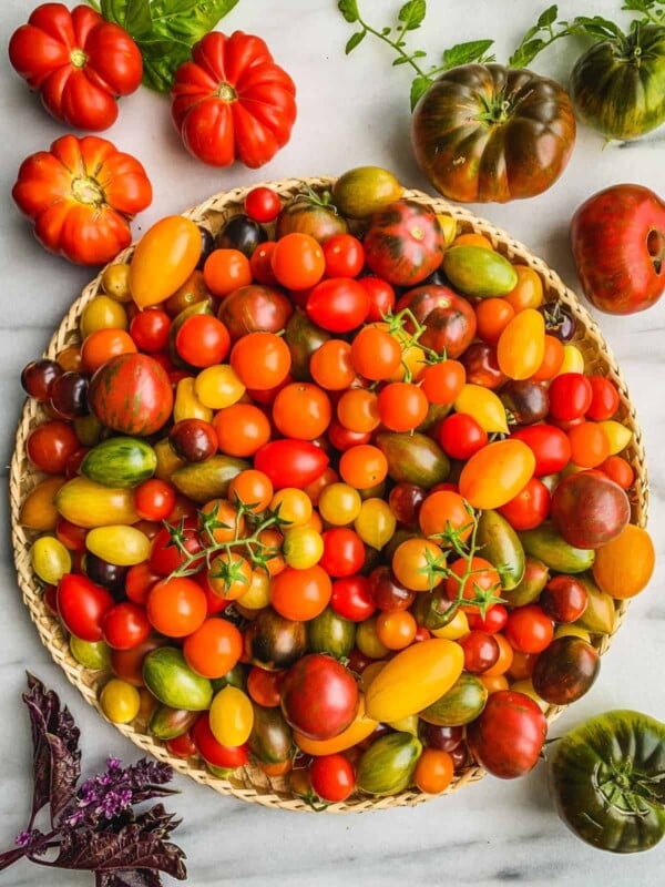 Cherry tomatoes on a large straw tray.