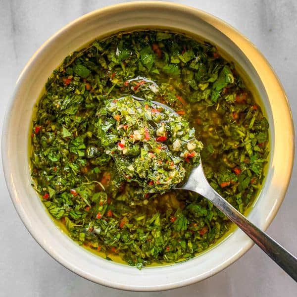 chimichurri sauce in bowl with spoon