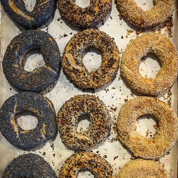 Bagels covered with sesame seeds, poppy seeds and everything bage.