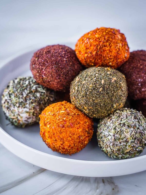 Labneh balls stacked on a plate.