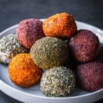 Labneh balls stacked on a plate.