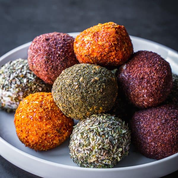 Labneh balls stacked on a plate.