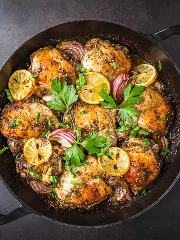 Zaatar chicken thighs cooked and garnished with parsley.