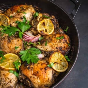 Zaatar chicken thighs cooked and garnished with parsley.