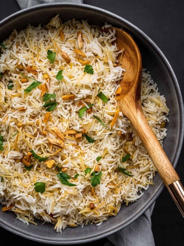 Rice with nuts and parsley on a plate.