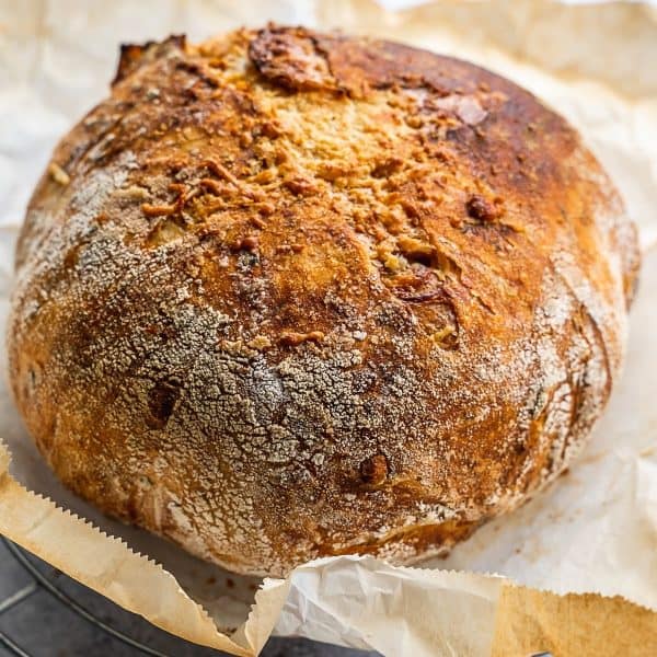 freshly baked load of bread on parchment paper.
