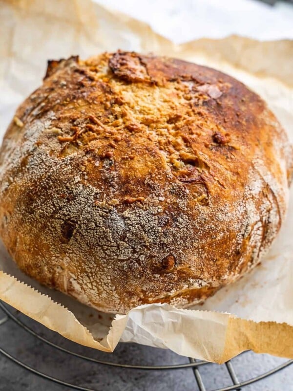 freshly baked load of bread on parchment paper.