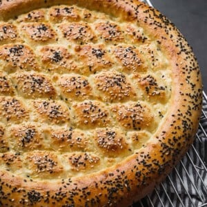 Ramazan pidesi turkish pide bread on a cooling rack.