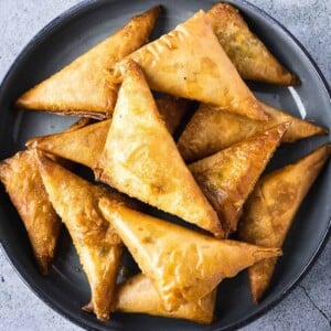 Deep fried pastries in a bowl.