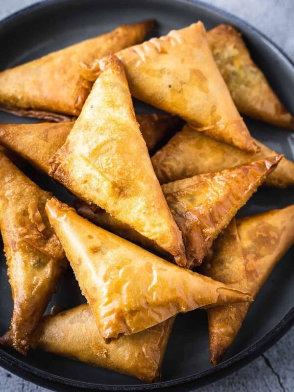 Deep fried pastries in a bowl.