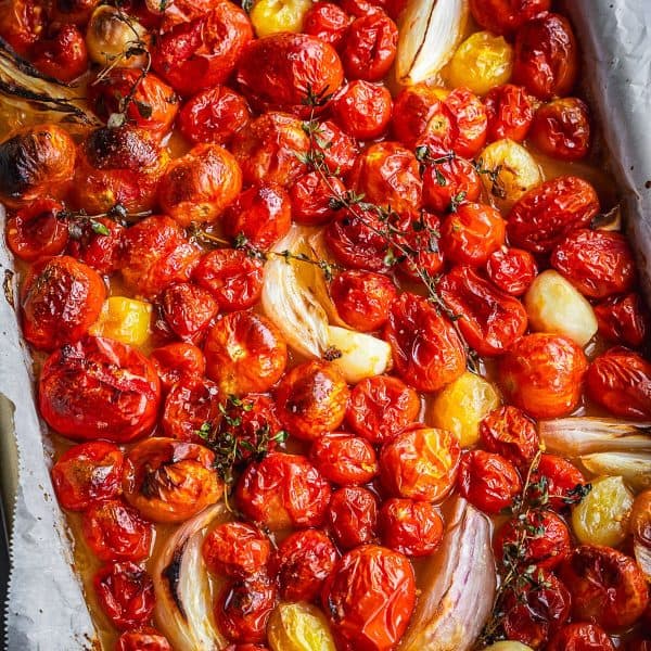 Tray of roasted cherry tomatoes and onions.