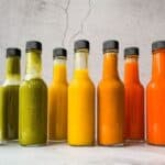 Fermented hot sauces in hot sauce bottles.
