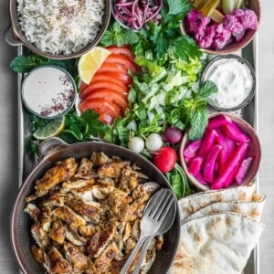 Chicken shawarma platter with all the sides and toppings.