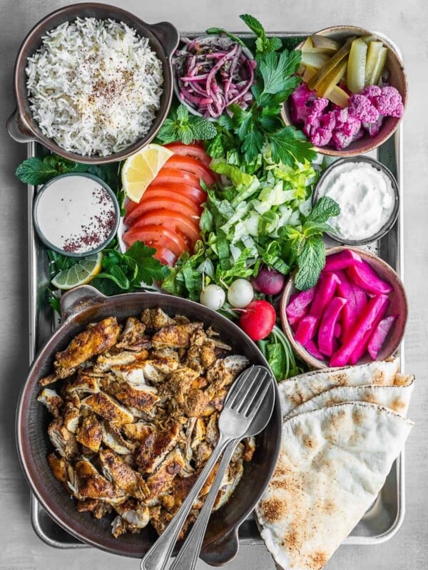 Chicken shawarma platter with all the sides and toppings.