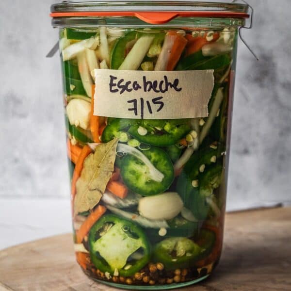 Mason jar full of Mexican pickled vegetables.
