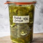 Mason jar full of quick pickled jalapenos.