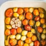 Slow baked cherry tomatoes with garlic and herbs in olive oil.