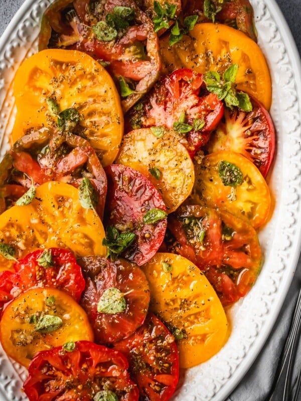 Marinated tomatoes on a platter.