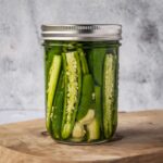 Jar of pickled serrano peppers.