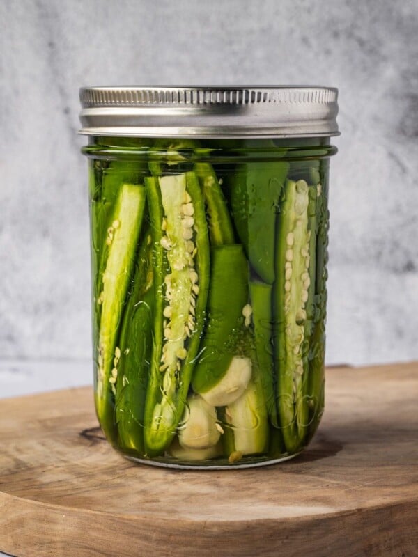 Jar of pickled serrano peppers.