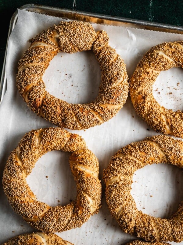 Baked simit on a baking sheet.