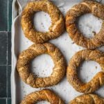 Baked simit on a baking sheet.