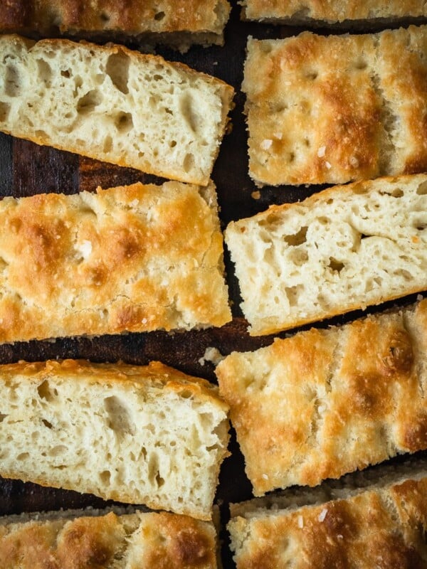 Butter croissant focaccia slices on a board.