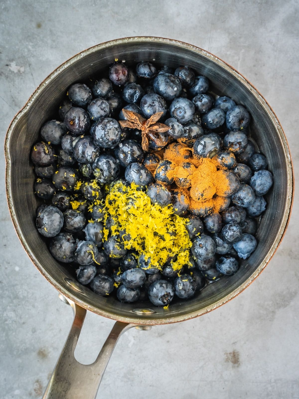 Blueberries, maple syrup, lemon zest, lemon juice, star anise, cinnamon and salt in a saucepan.