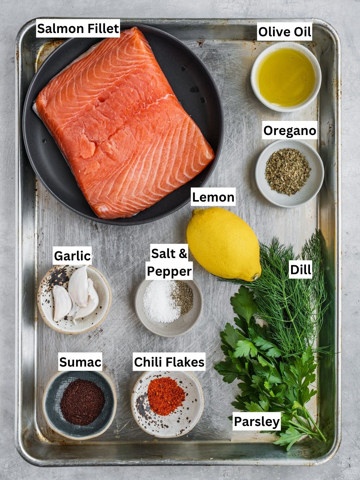Grilled Mediterranean Salmon Kabobs recipe ingredients with individual labels on a metal tray.