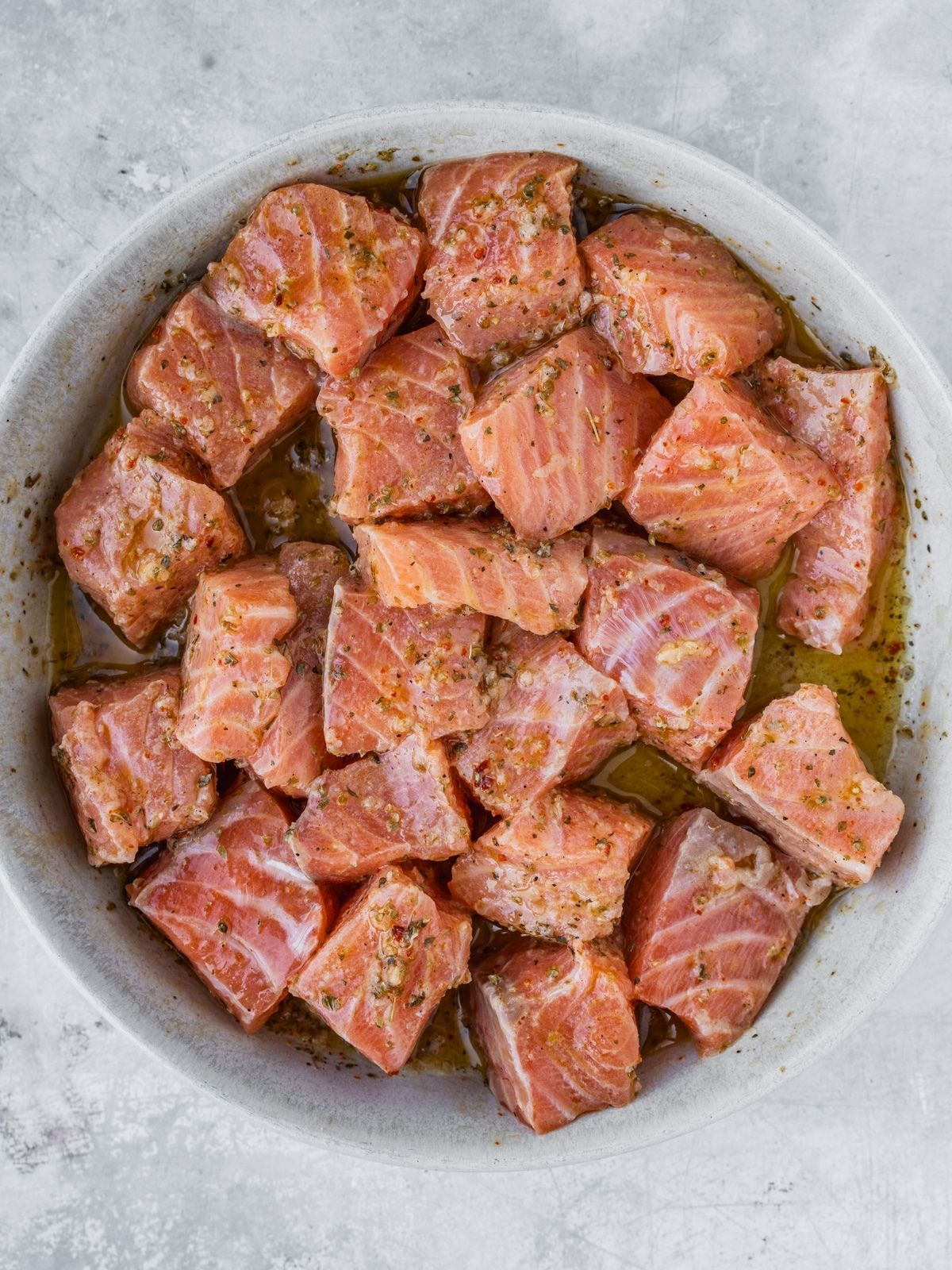Salmon cubes soaking up the prepared marinade.