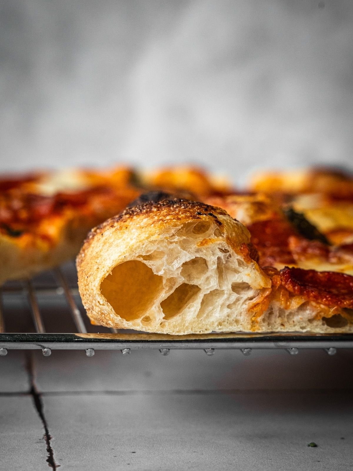 Cross-section of the Neapolitan pizza crust showing how airy it is.