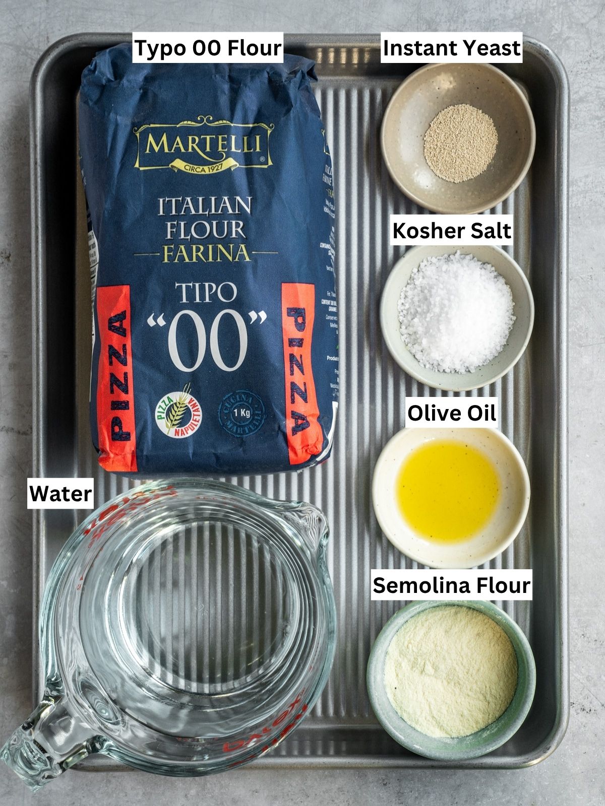 Overnight Biga Preferment Neapolitan Pizza Dough recipe ingredients with individual labels on a metal tray.