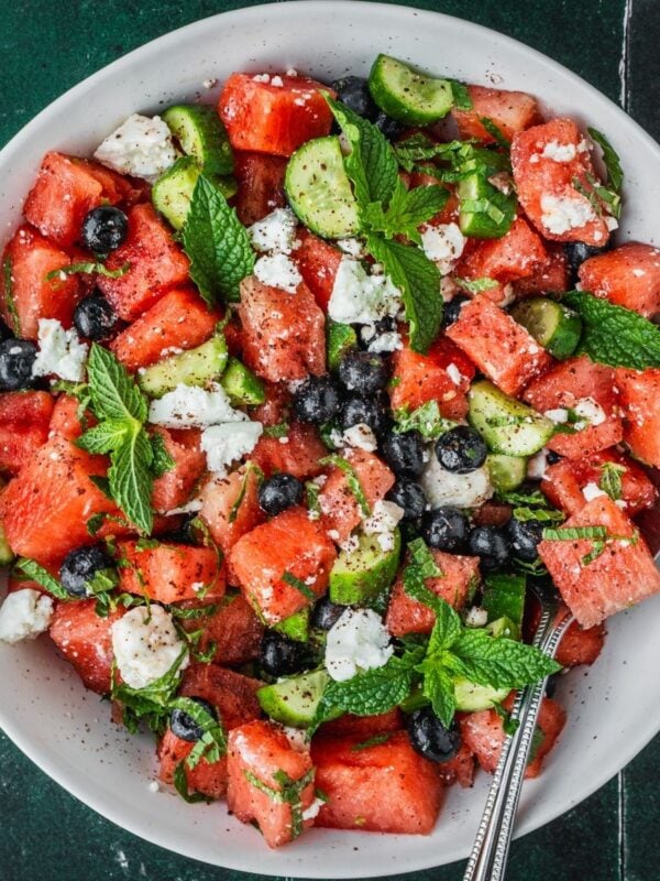 Watermelon blueberry feta salad with fresh mint in a serving bowl.
