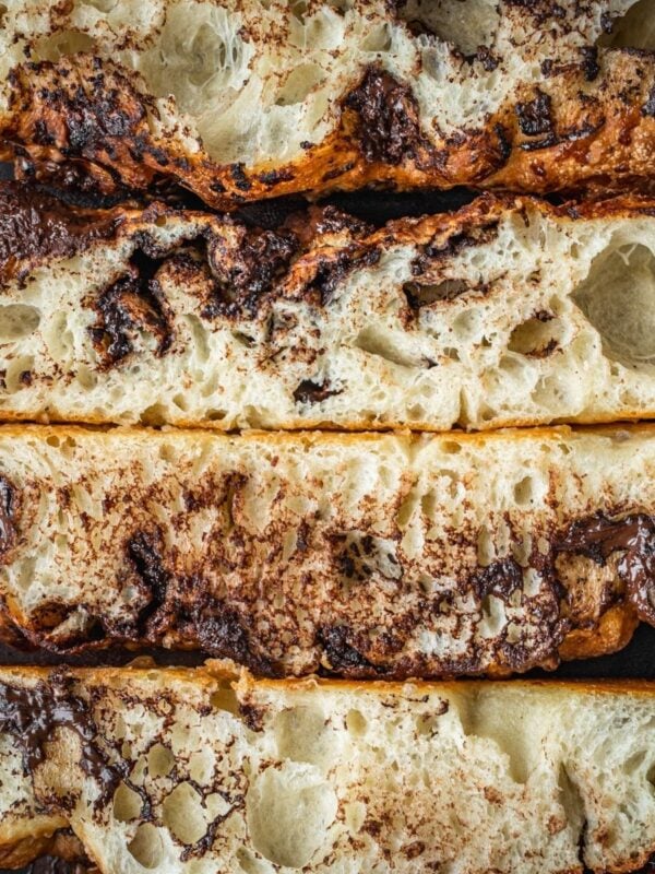 Chocolate Focaccia slices on a wooden cutting board.