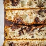 Chocolate Focaccia slices on a wooden cutting board.