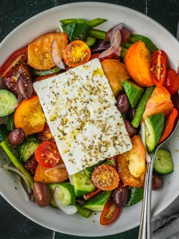 Hortiaki Greek Salad with fresh tomatoes, bell peppers, cucumbers, red onions, feta and oregano.