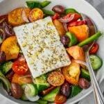 Hortiaki Greek Salad with fresh tomatoes, bell peppers, cucumbers, red onions, feta and oregano.
