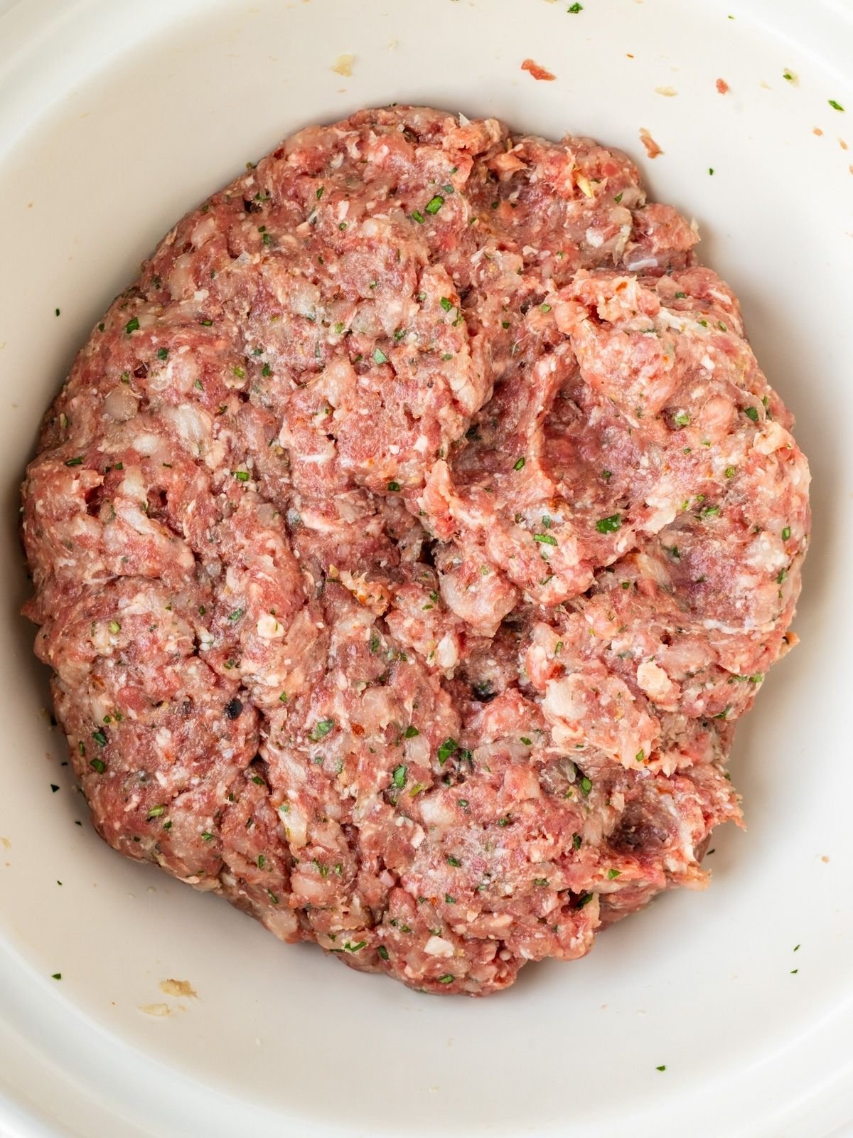 Bowl with ground meat mixture.