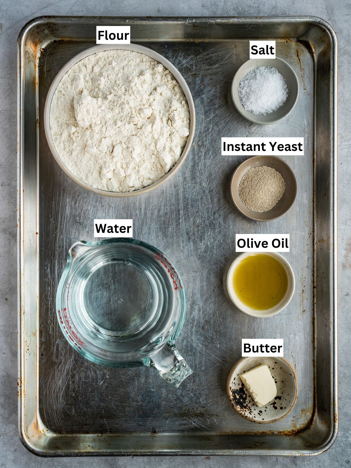 Detroit Style Pizza Recipe base dough ingredients with individual labels on a metal tray.