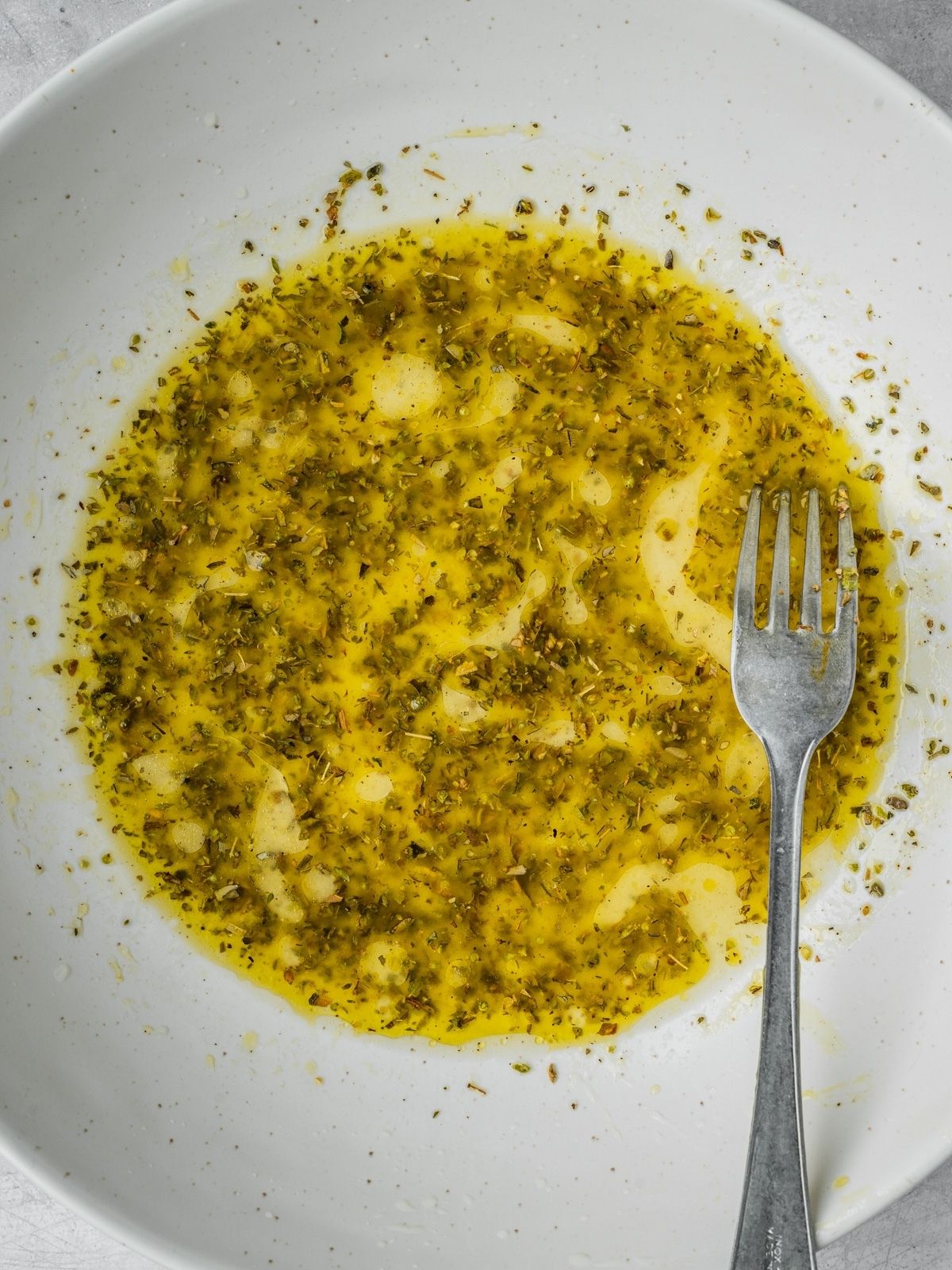 Salad dressing in a large bowl.