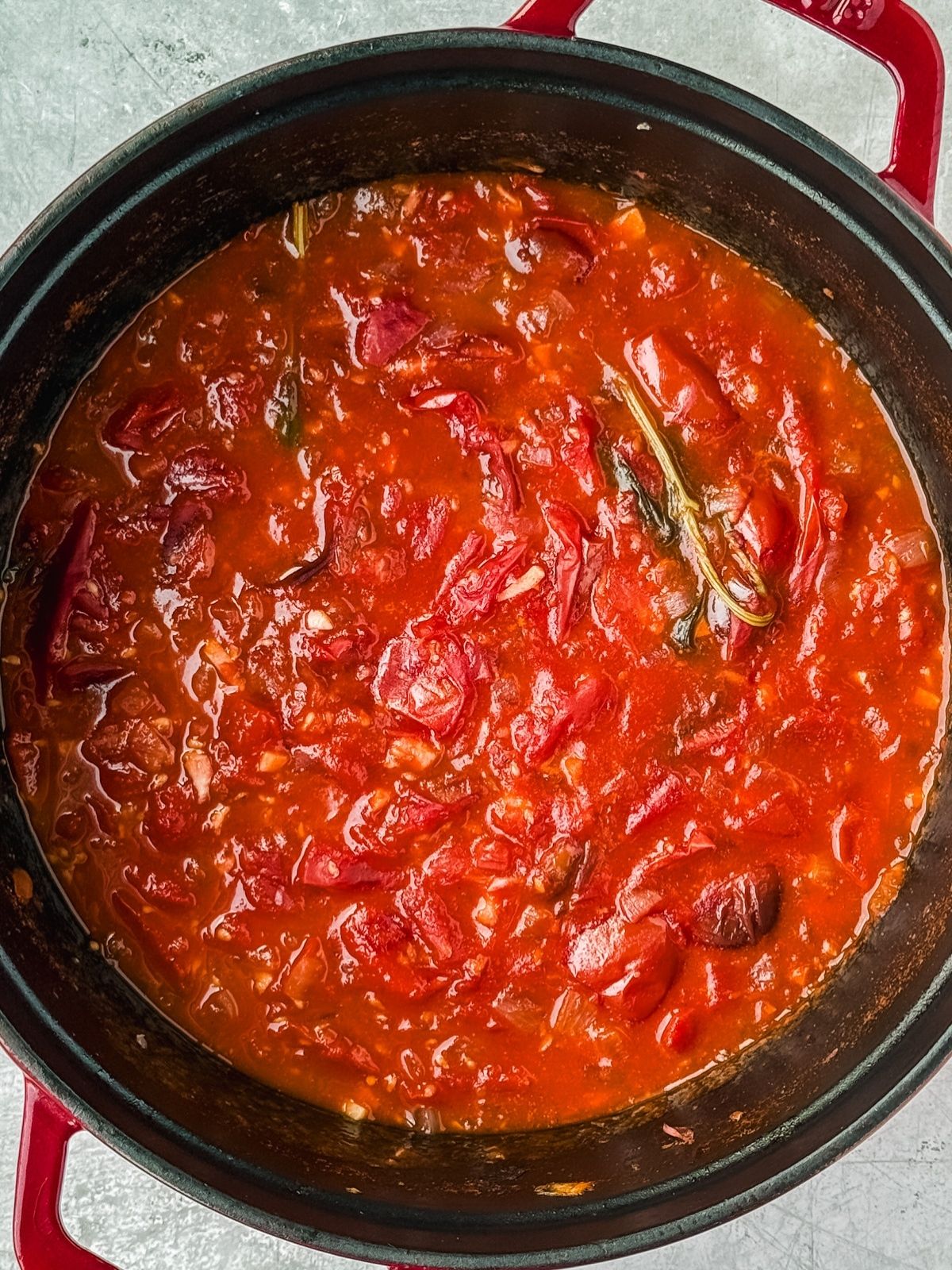The cooked sauce in the pot, still chunky and waiting to be milled.