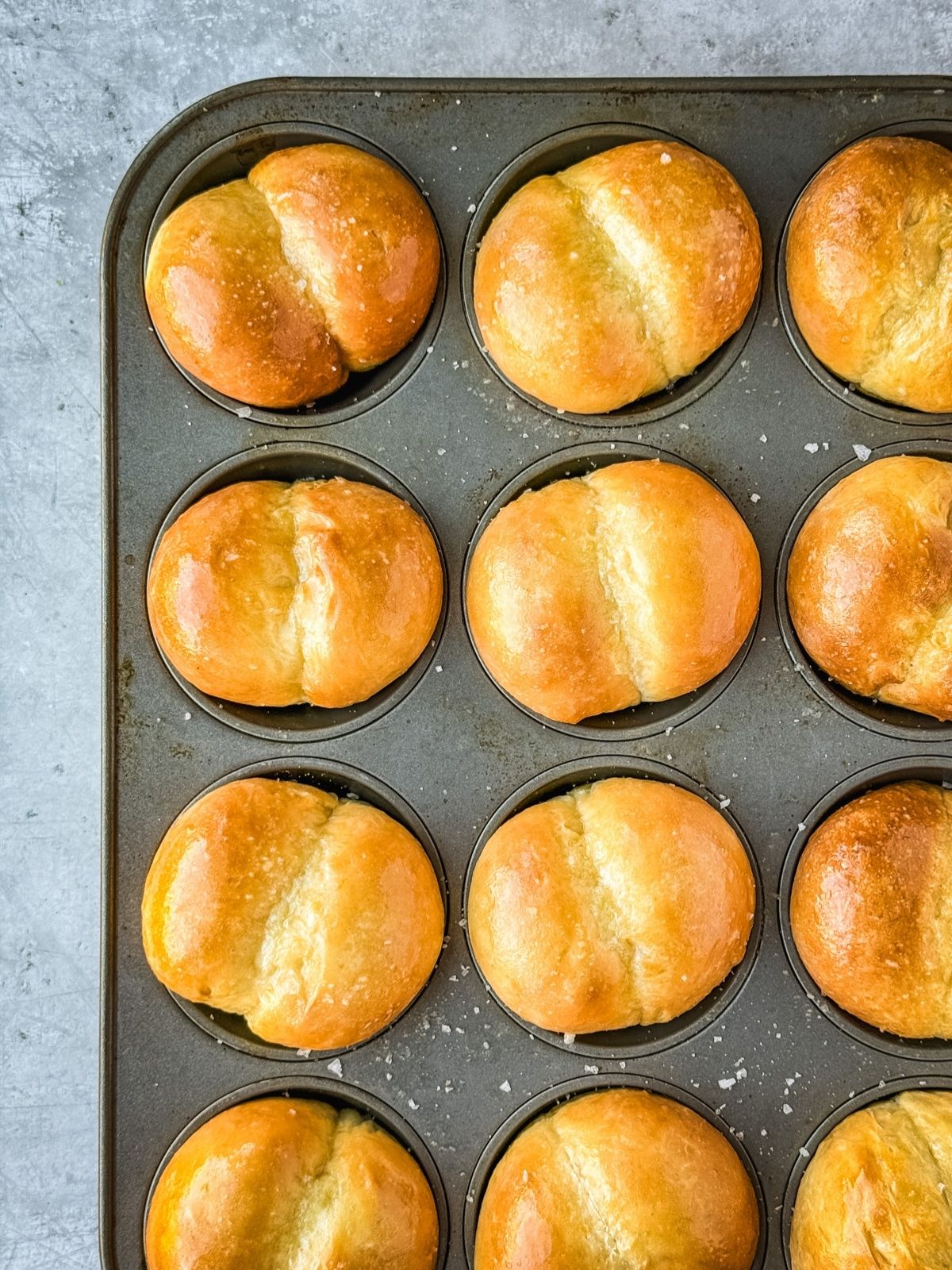 Double cheeked buns in a muffin tin. 