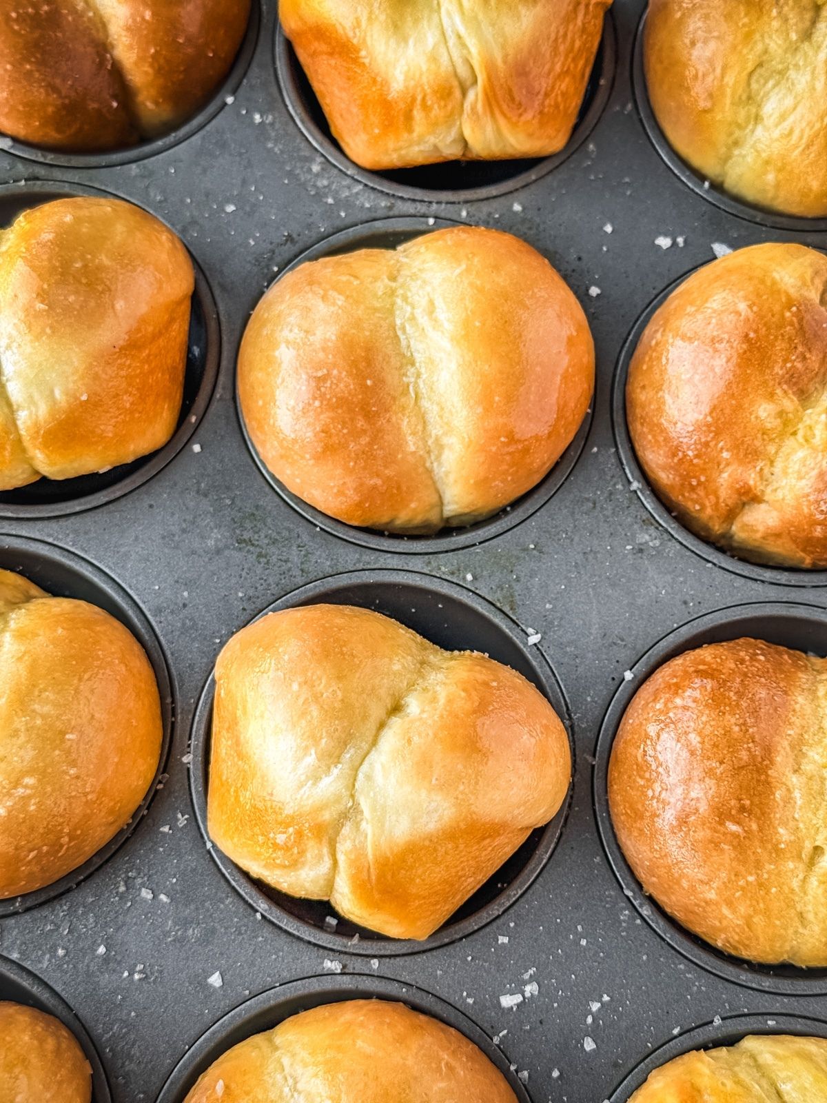 Double cheeked buns in a muffin tin.