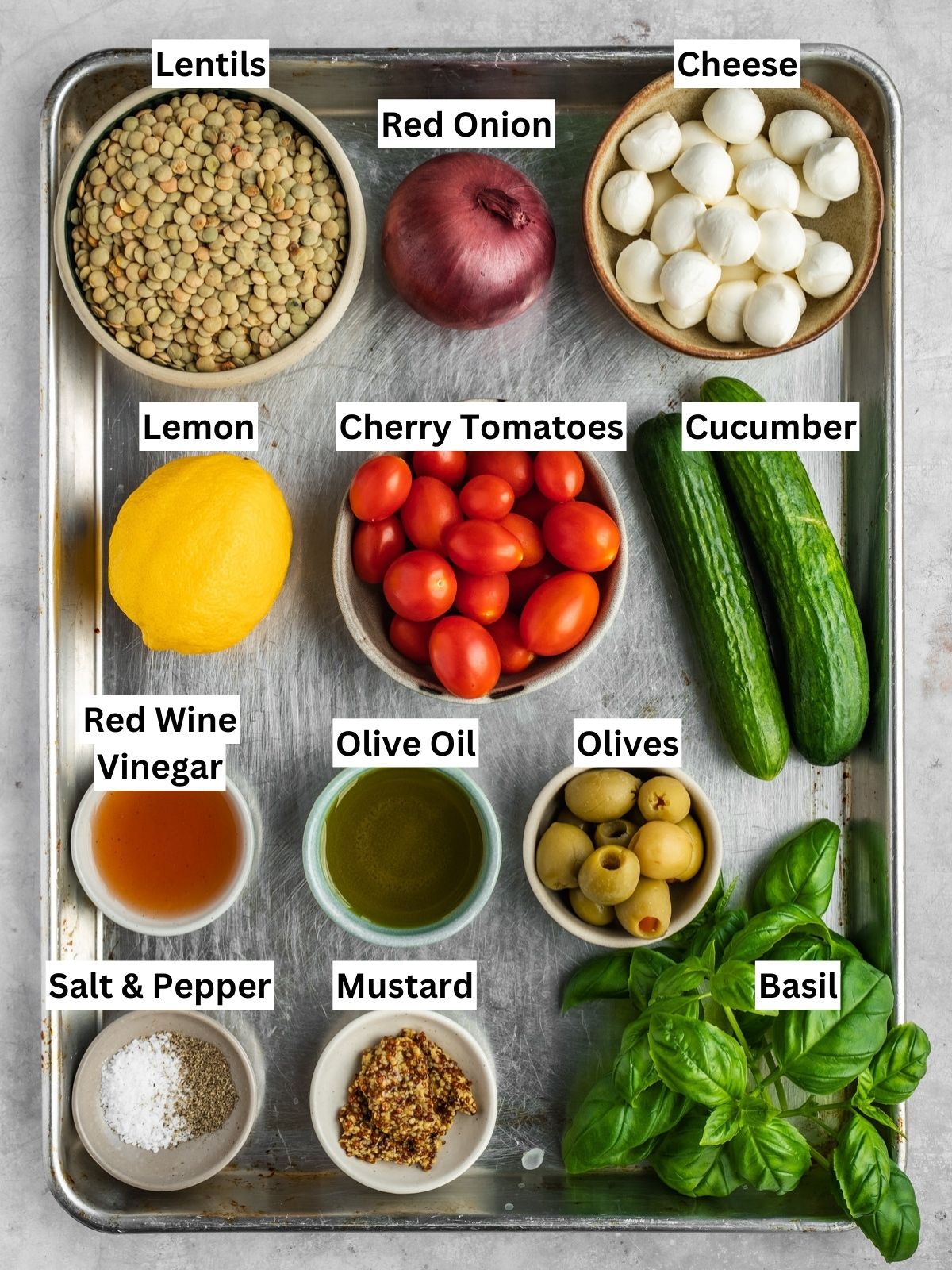 Mediterranean Lentil Salad recipe ingredients with individual labels on a metal tray.