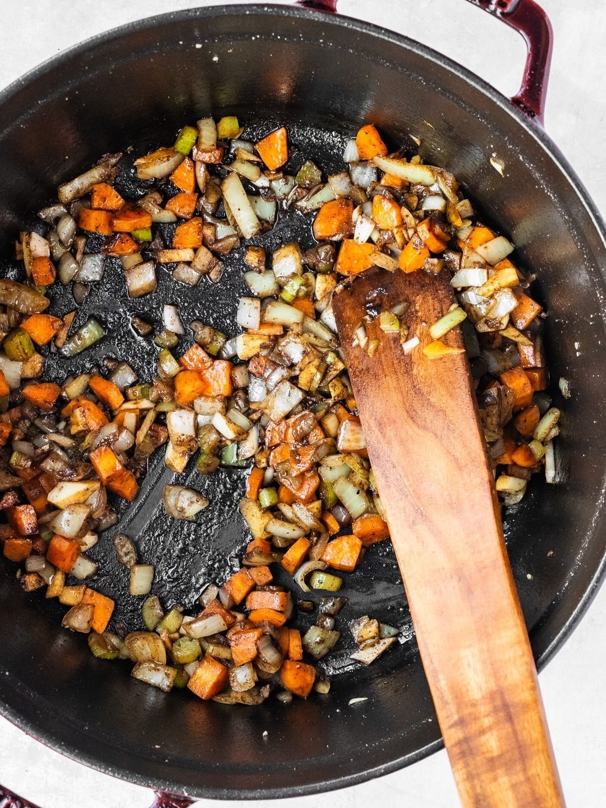 Large pot with celery, onions, garlic, carrots and spices sautéing.