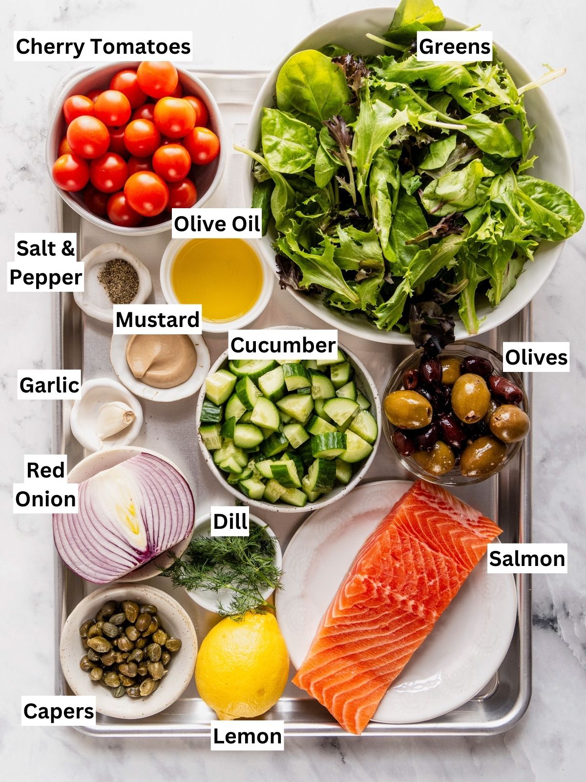 Mediterranean Salmon Salad recipe ingredients with individual labels on a metal tray.