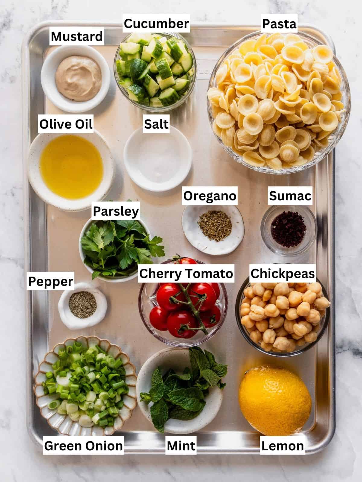 Mediterranean Chickpea Pasta Salad recipe ingredients with individual labels on a metal tray.