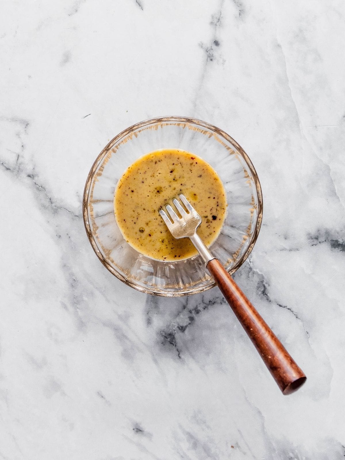 Lemon Sumac Salad dressing in a small mixing bowl.