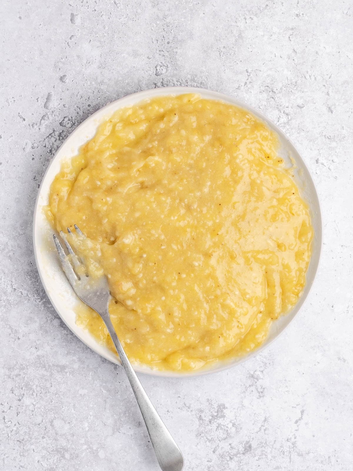 Bowl with mashed up bananas.