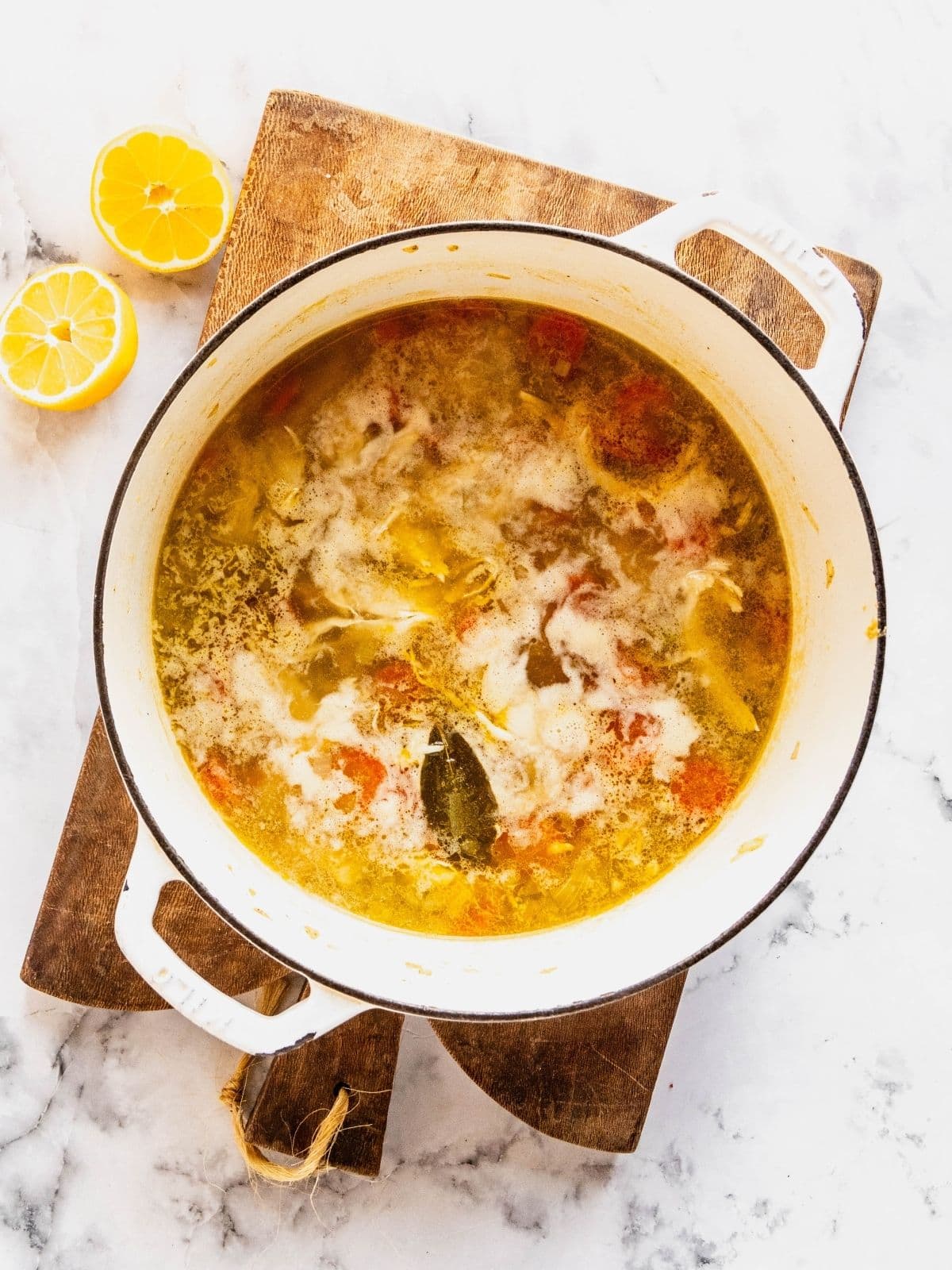 Recipe step showing the addition of the lemon juice to the soup.